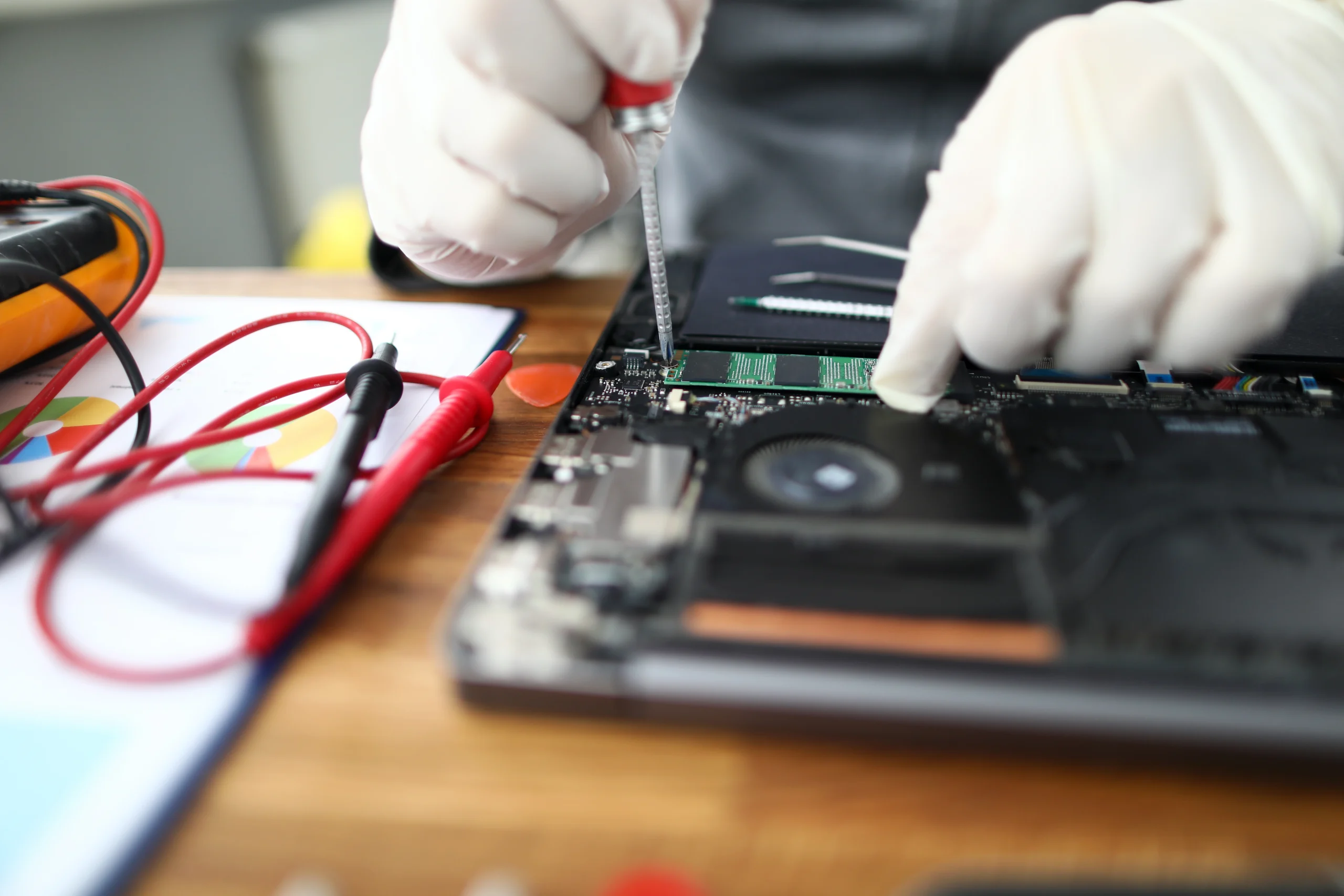 technician repairing a laptop
